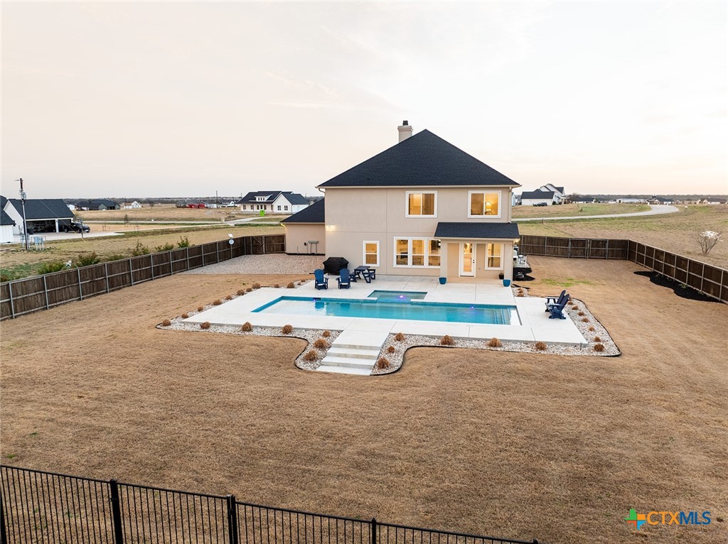477 Willow Moon Ranch Road Crawford, TX 76638 - Photo 36 of 40 swimming pool view with a seating space