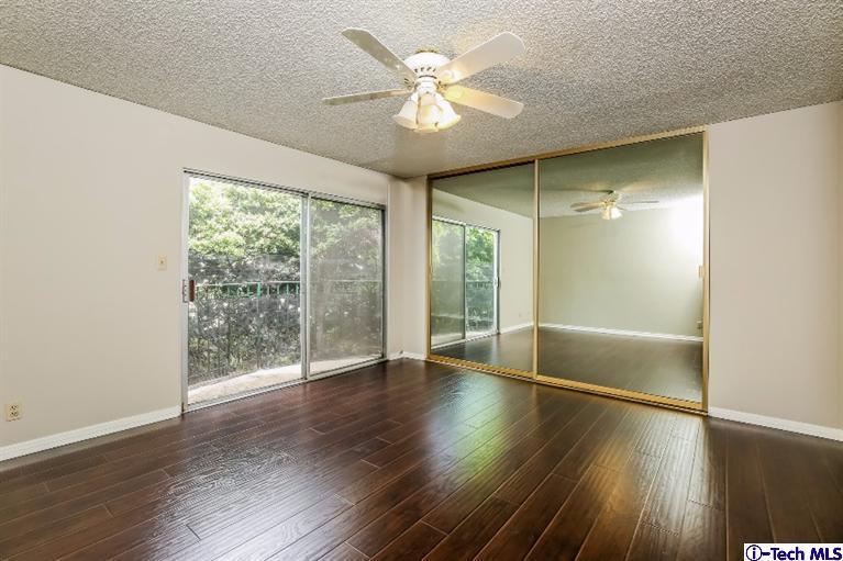 841 West Duarte Road, Unit 4 Arcadia, CA 91007 - Photo 14 of 25 a view of an empty room with wooden floor and a window