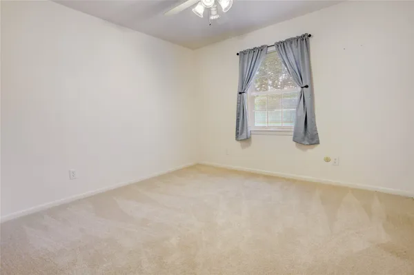a bathroom with a shower and a sink