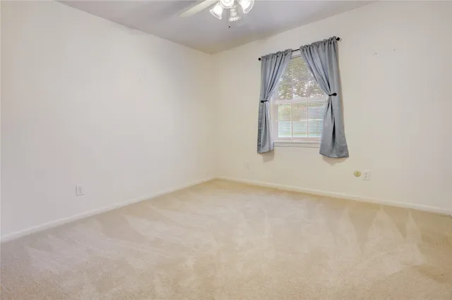 a bathroom with a shower and a sink