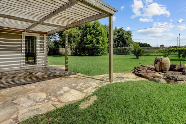 a view of a chairs and table in the garden