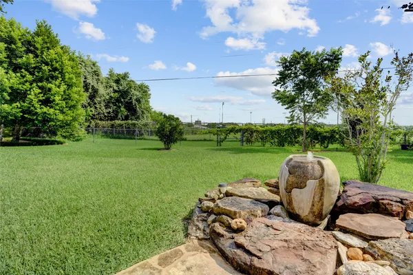 a view of a house with a yard and sitting area