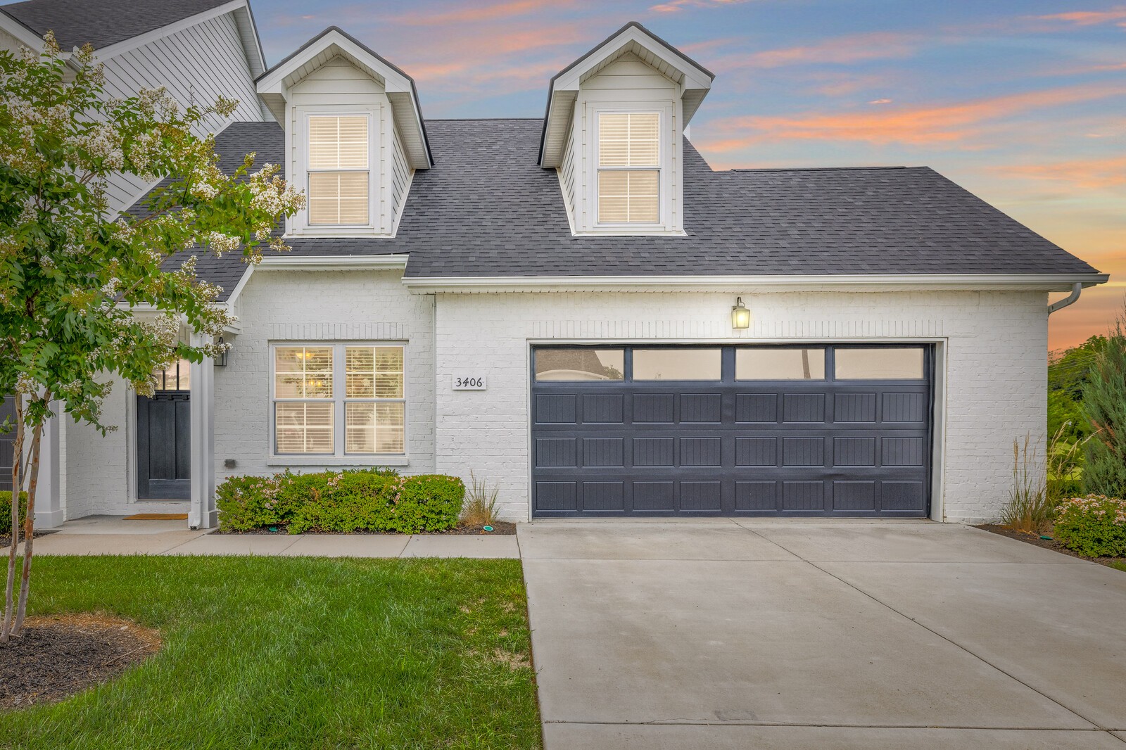 a front view of a house with a yard