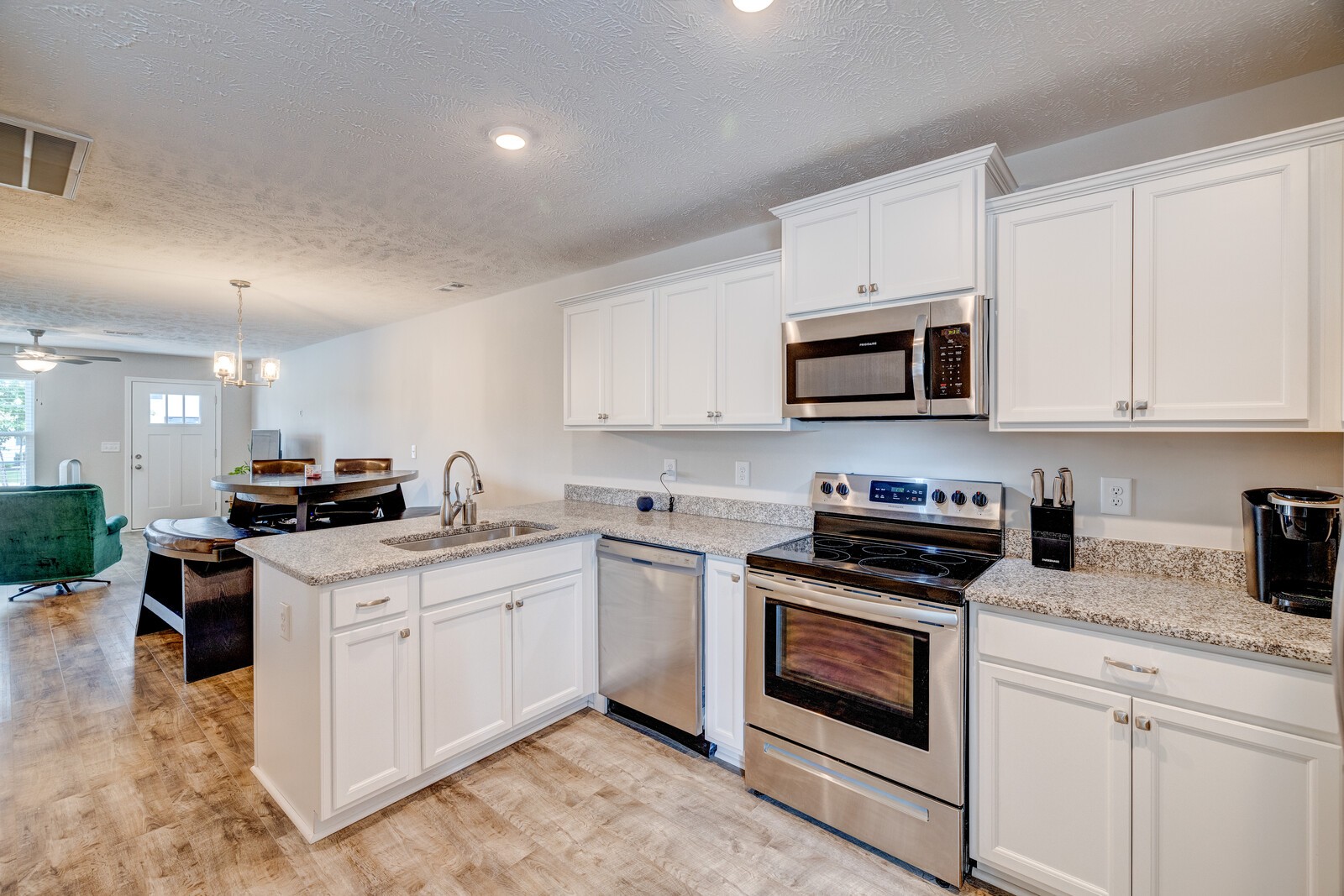 3406 Learning Lane Murfreesboro, TN 37128 - Photo 14 of 32 a kitchen with stainless steel appliances granite countertop a stove top oven a sink dishwasher and a refrigerator