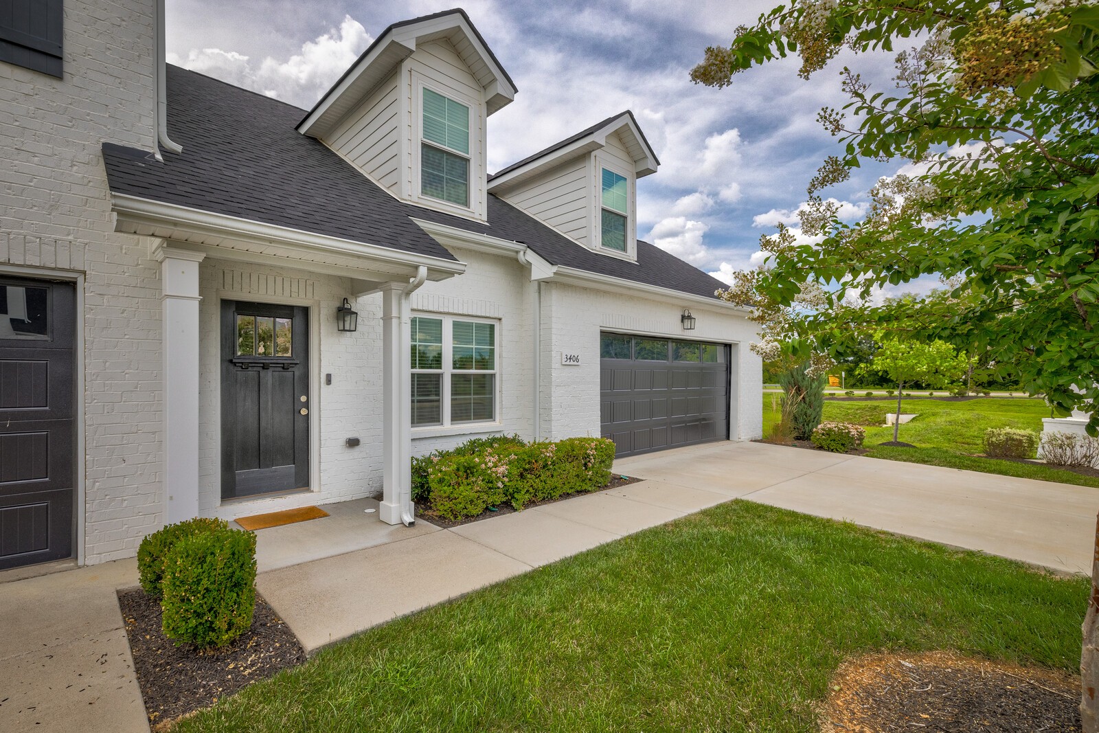 3406 Learning Lane Murfreesboro, TN 37128 - Photo 2 of 32 a front view of a house with a yard and garage