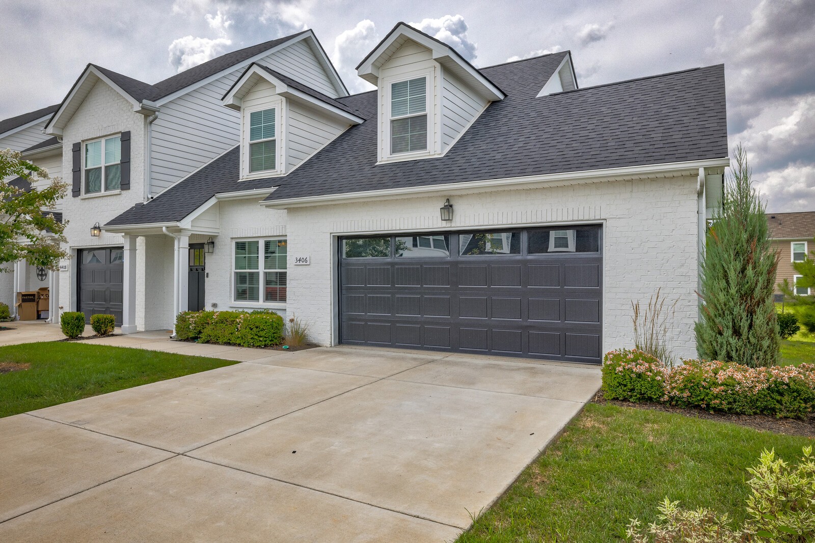 3406 Learning Lane Murfreesboro, TN 37128 - Photo 3 of 32 a front view of a house with a yard and garage