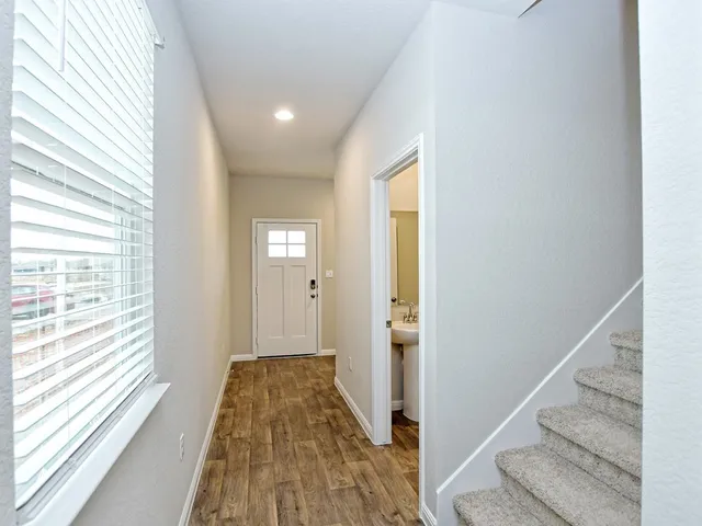 a bathroom with a sink toilet and a mirror