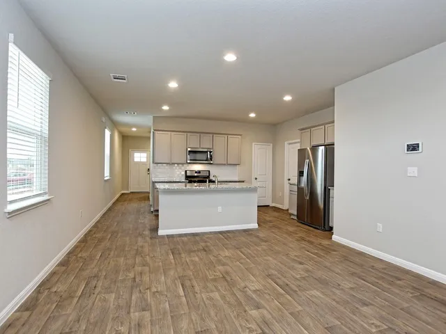 a view of kitchen with wooden floor