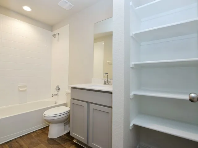 a view of a garden with a wooden fence