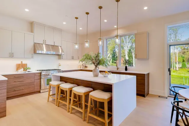 a view of a dining room with furniture and chandelier