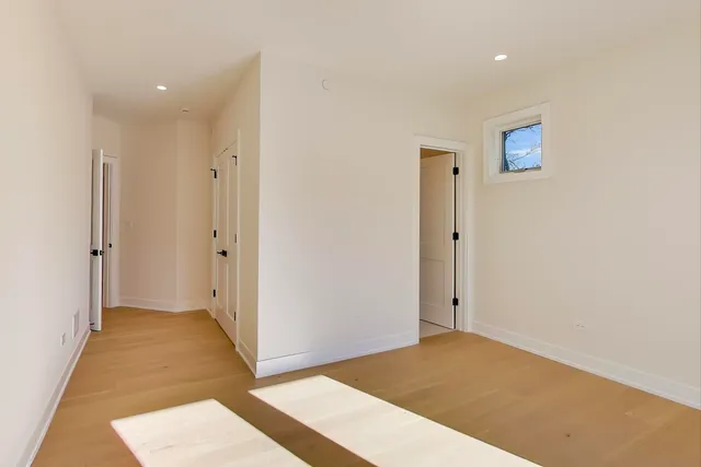 a bathroom with double sink and a mirror