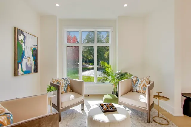 a dining room with furniture and wooden floor