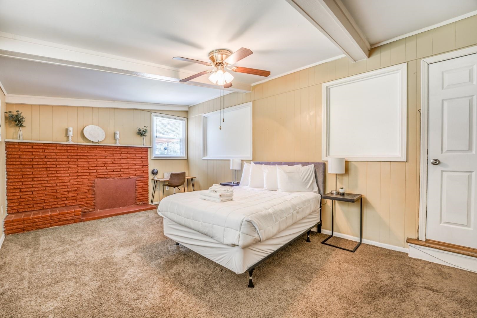 3661 McCorkle Road Memphis, TN 38116 - Photo 11 of 25 a bedroom with a bed lamp and a chandelier