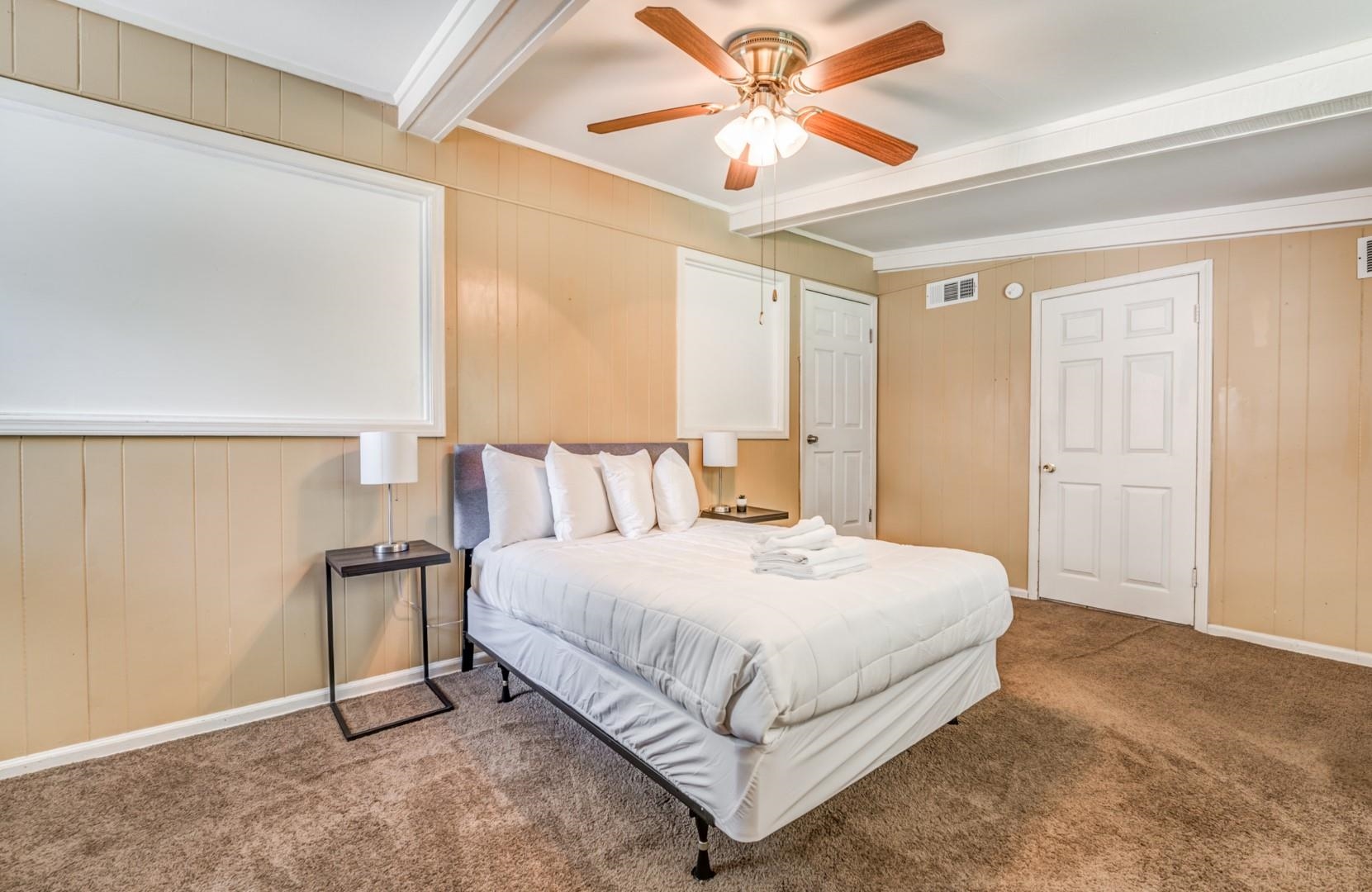 3661 McCorkle Road Memphis, TN 38116 - Photo 12 of 25 a bedroom with a bed chandelier and a window