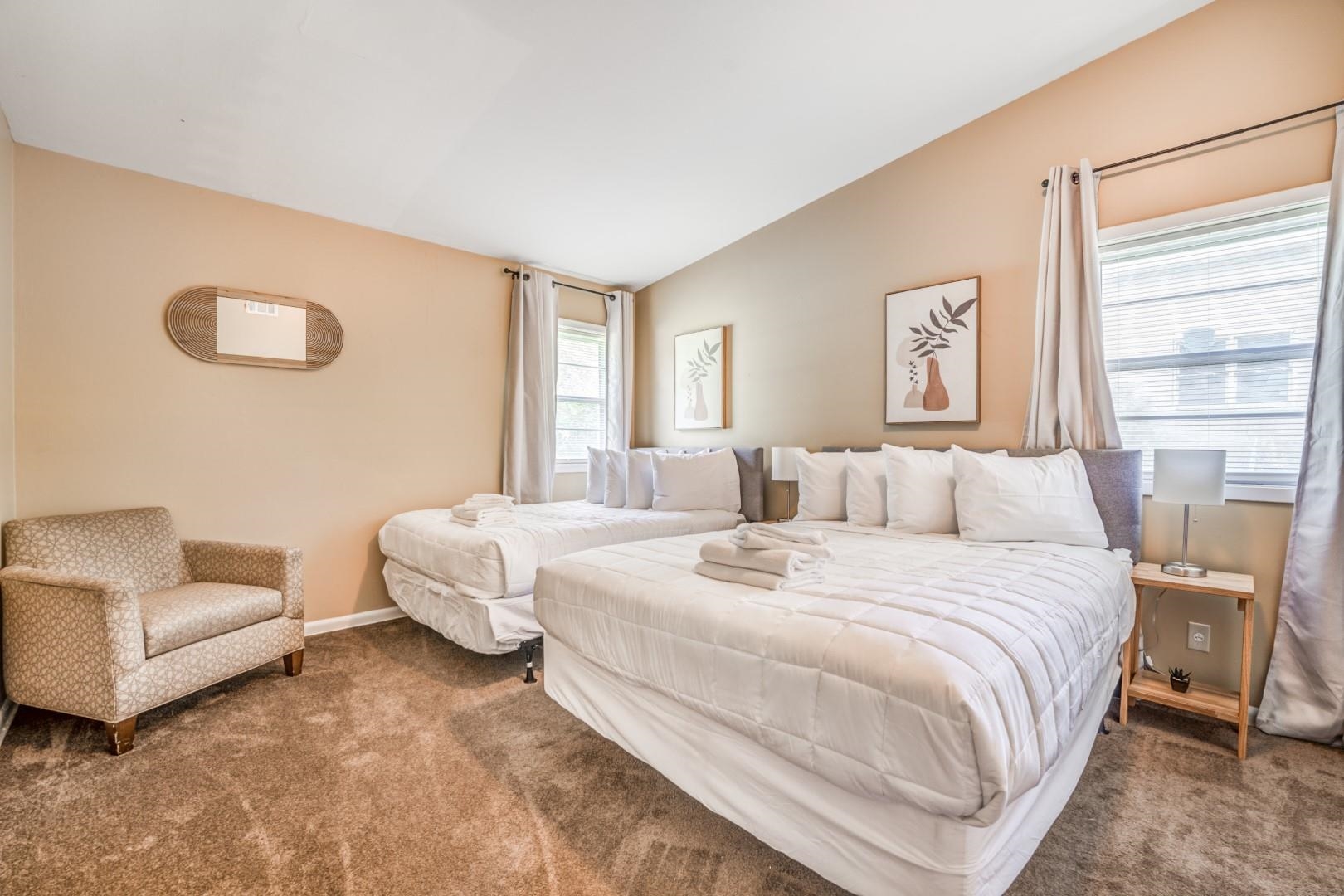 3661 McCorkle Road Memphis, TN 38116 - Photo 15 of 25 a spacious bedroom with a bed and a couch