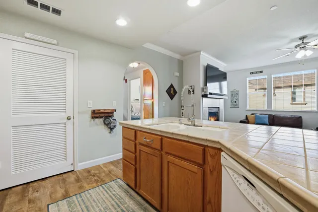 a view of a kitchen from the room and windows