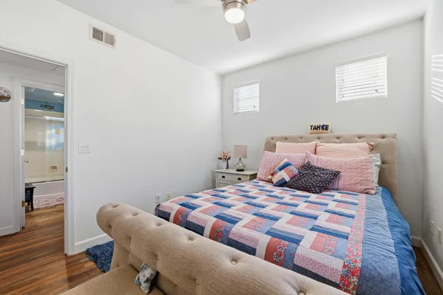 a bedroom with a bed and a chair