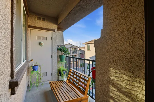 a view of a balcony with wooden floor