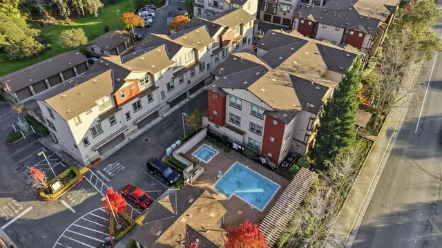 an aerial view of a building with a yard