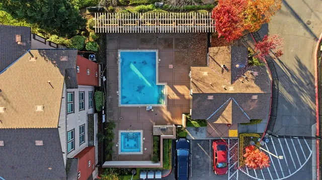 an aerial view of houses with outdoor space