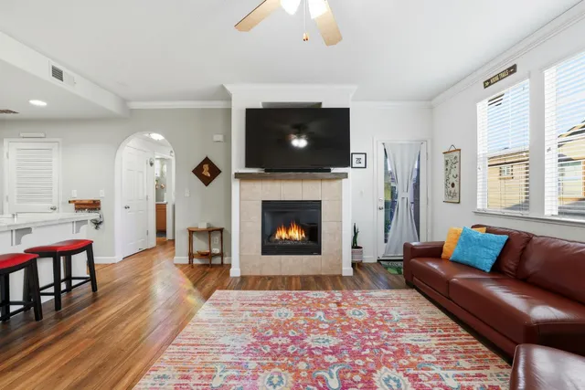 a living room with furniture and a fireplace