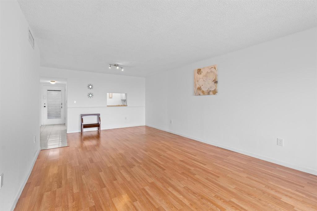 1830 Southwest 81st Avenue, Unit 4317 North Lauderdale, FL 33068 - Photo 13 of 22 a view of empty room with wooden floor