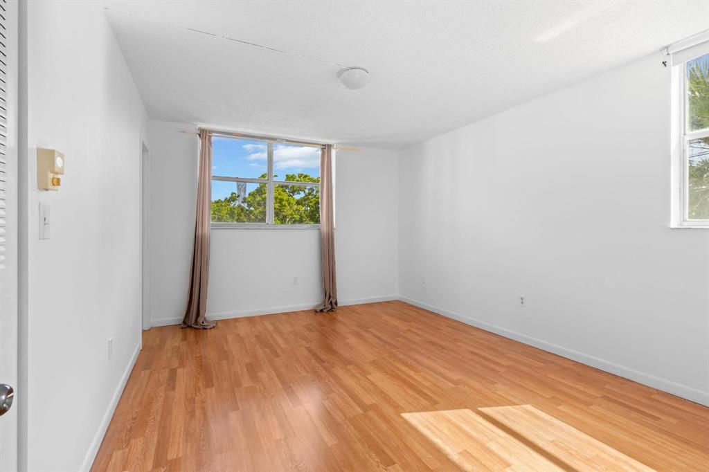 1830 Southwest 81st Avenue, Unit 4317 North Lauderdale, FL 33068 - Photo 17 of 22 a bedroom with a bed and a window