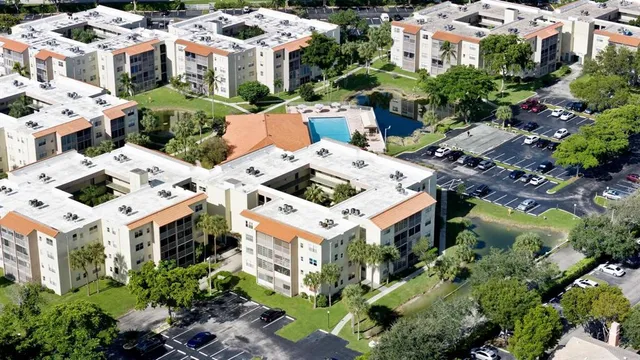 a view of a swimming pool with outdoor seating