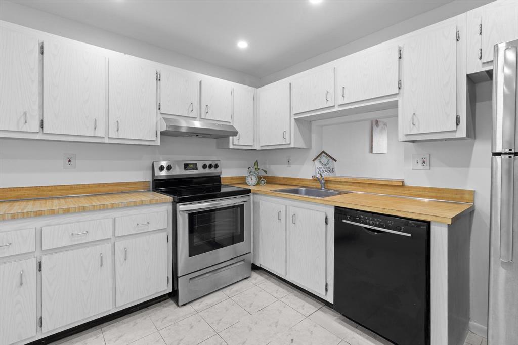 1830 Southwest 81st Avenue, Unit 4317 North Lauderdale, FL 33068 - Photo 7 of 22 a kitchen with granite countertop white cabinets and white appliances