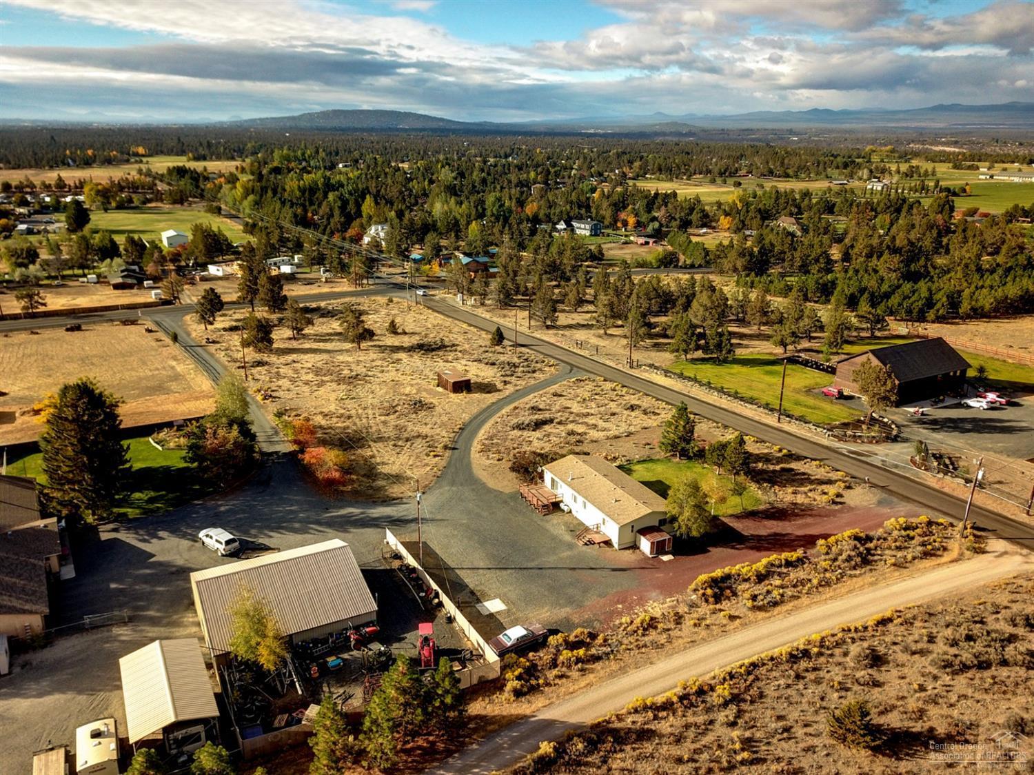 65040 Hunnell Road Bend, OR 97703 - Photo 22 of 25 an aerial view of residential building with parking space