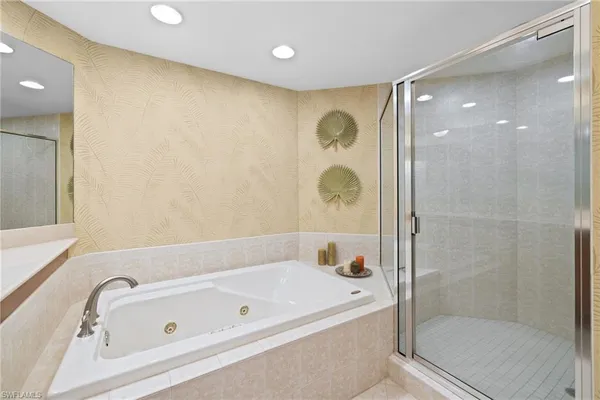 a bathroom with a bathtub and shower