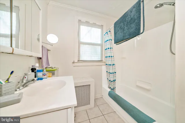 a bathroom with a sink a vanity and a bathtub