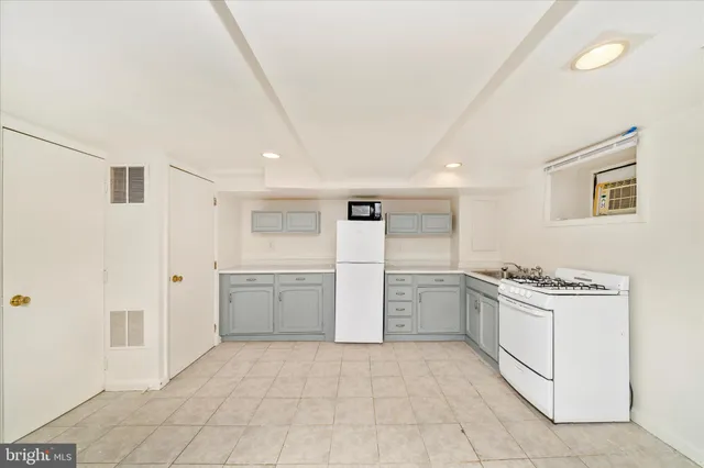 a kitchen with a cabinets and appliances