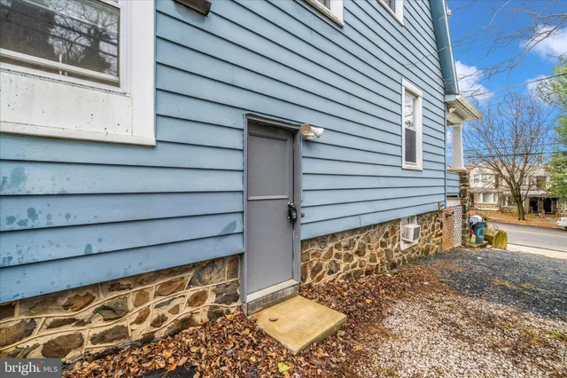 a view of house with wooden fence