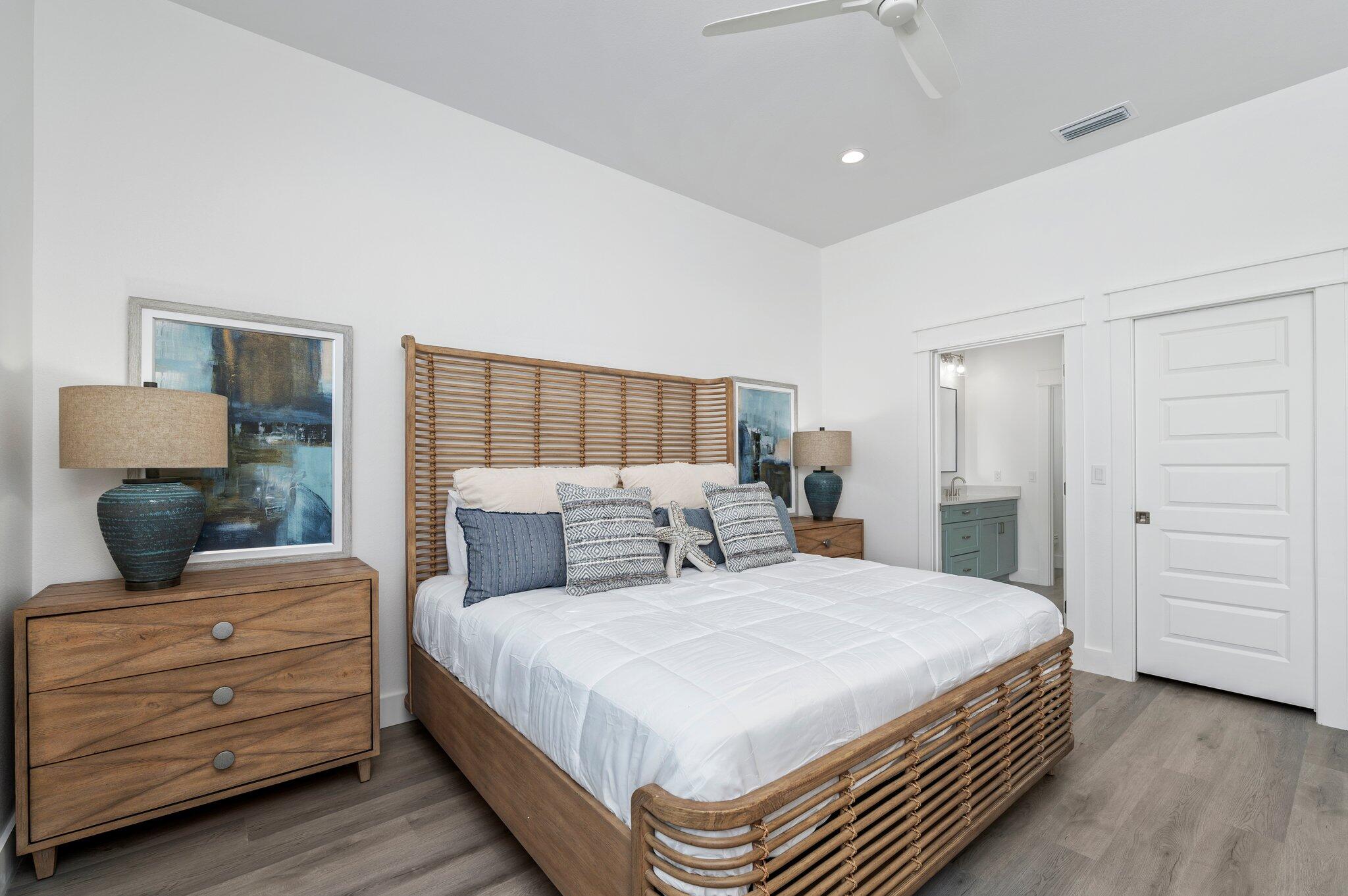 54 North Gulf Drive Santa Rosa Beach, FL 32459 - Photo 18 of 67 a bedroom with a large bed and a dresser
