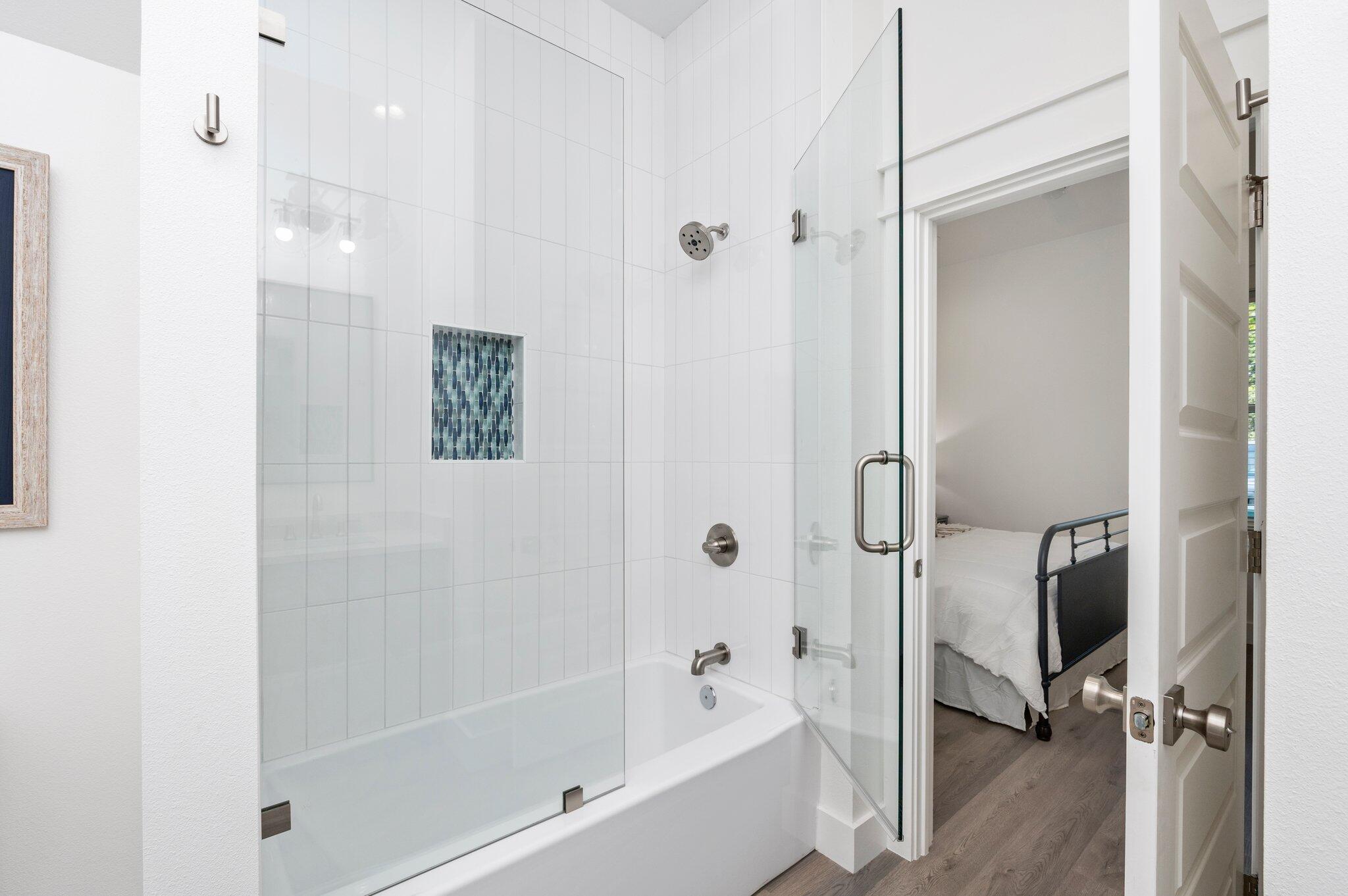 54 North Gulf Drive Santa Rosa Beach, FL 32459 - Photo 26 of 67 a bathroom with a bathtub and a shower