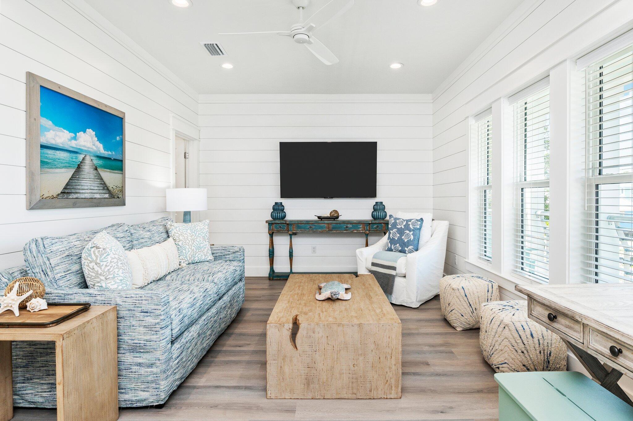 54 North Gulf Drive Santa Rosa Beach, FL 32459 - Photo 29 of 67 a living room with furniture and a flat screen tv