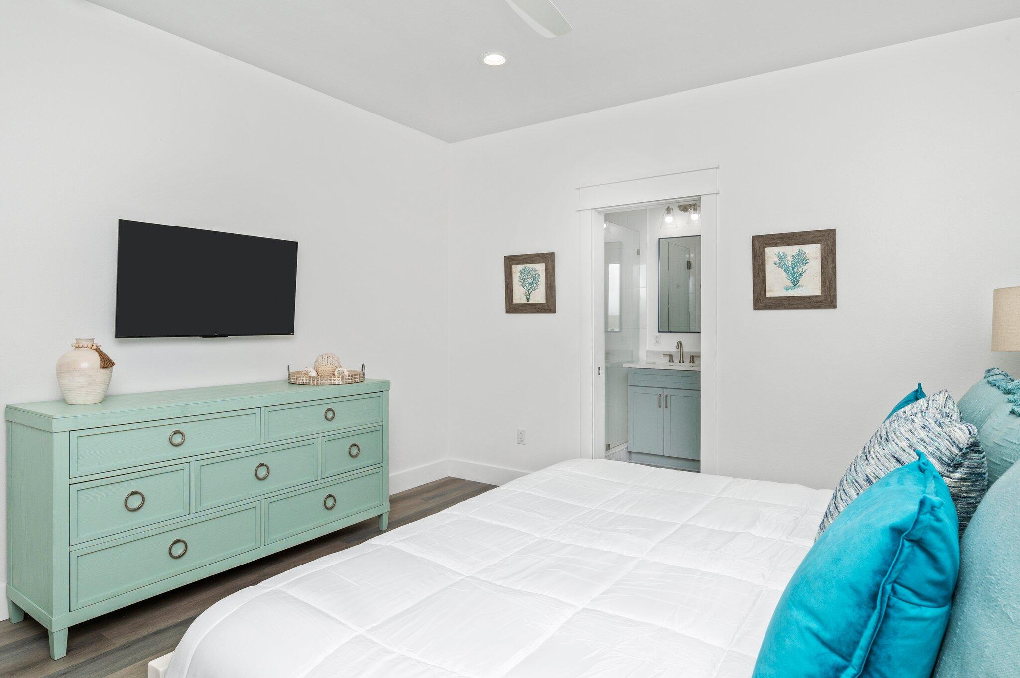 54 North Gulf Drive Santa Rosa Beach, FL 32459 - Photo 36 of 67 a bedroom with a bed and a flat screen tv
