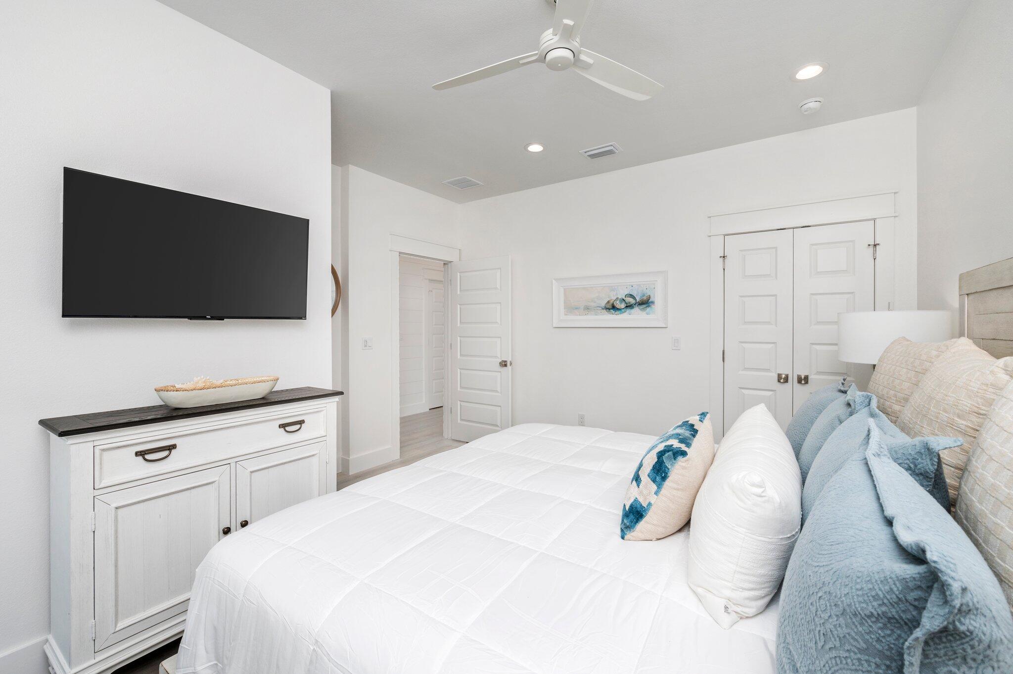 54 North Gulf Drive Santa Rosa Beach, FL 32459 - Photo 40 of 67 a bedroom with a bed and a flat screen tv