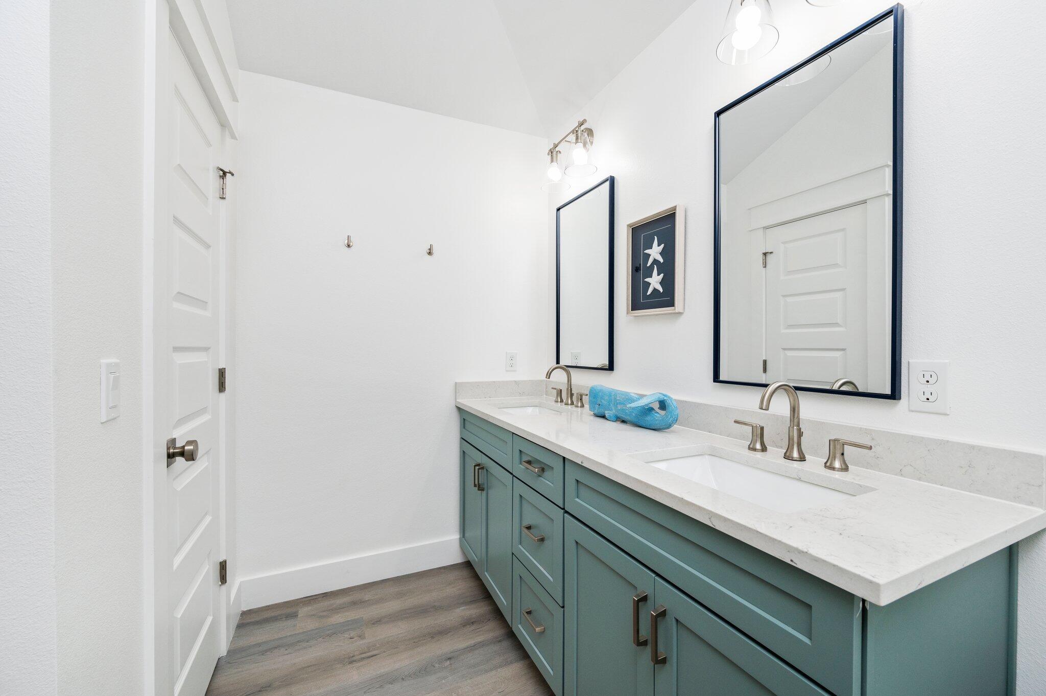 54 North Gulf Drive Santa Rosa Beach, FL 32459 - Photo 53 of 67 a bathroom with a double vanity sink and a mirror