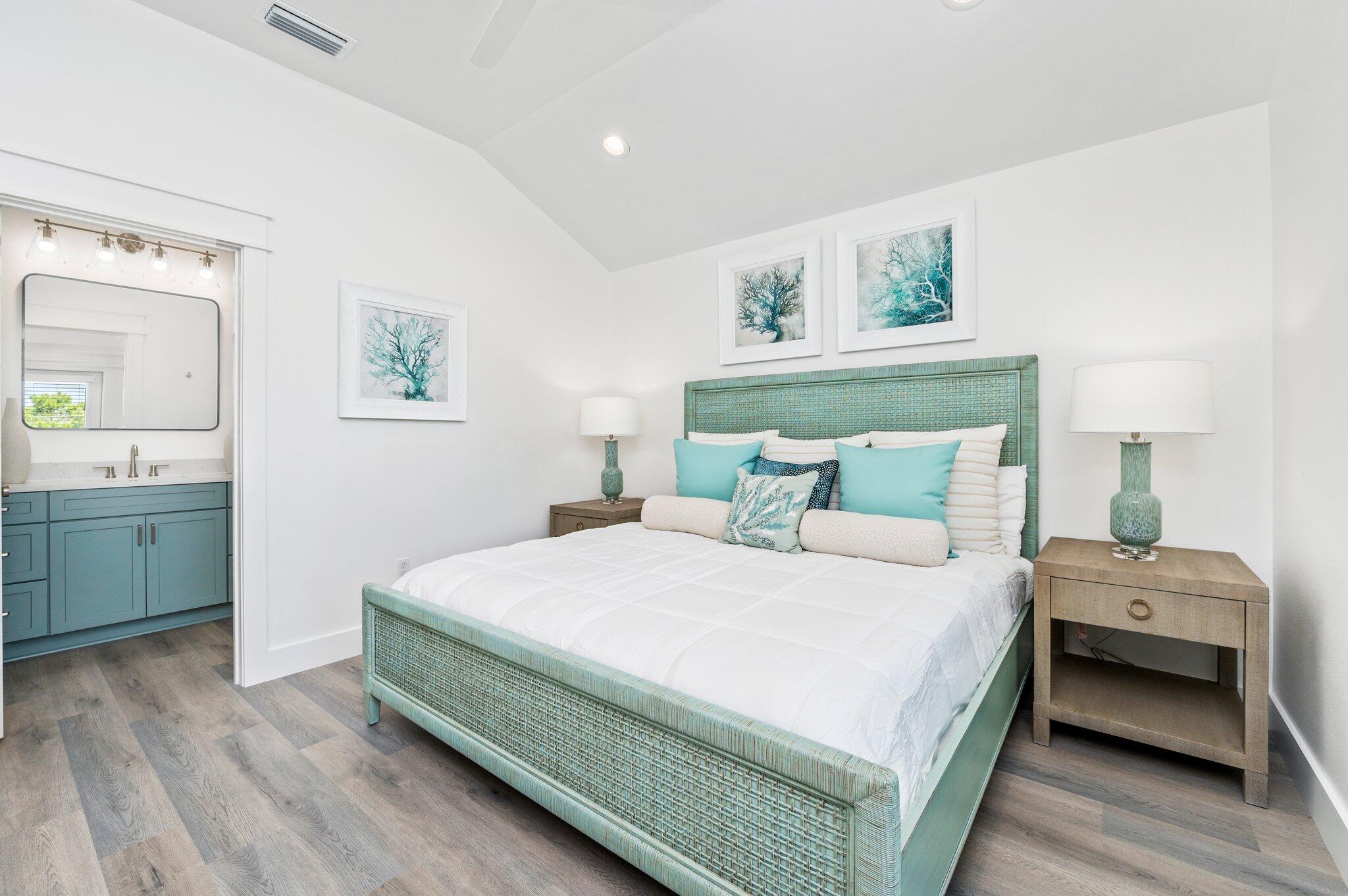 54 North Gulf Drive Santa Rosa Beach, FL 32459 - Photo 56 of 67 a bedroom with a bed and a chandelier