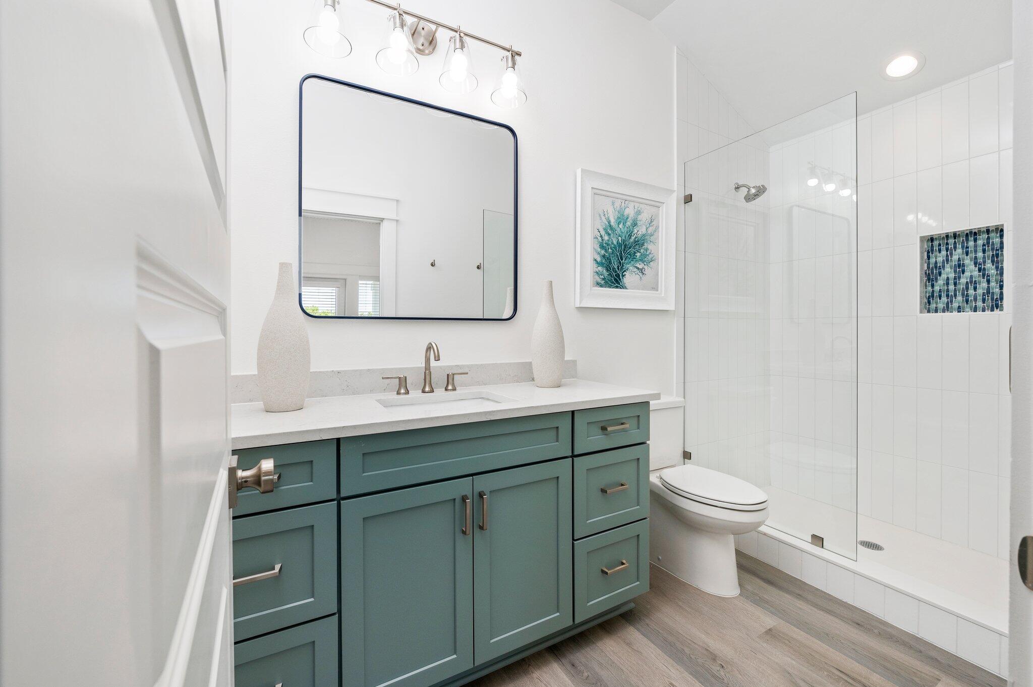 54 North Gulf Drive Santa Rosa Beach, FL 32459 - Photo 57 of 67 a bathroom with a toilet sink and mirror