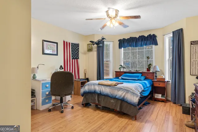 a bathroom with a sink toilet and a mirror