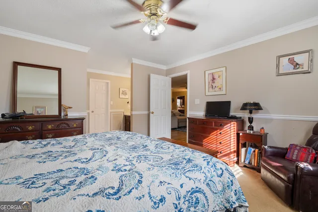 a white toilet sitting next to a bath tub