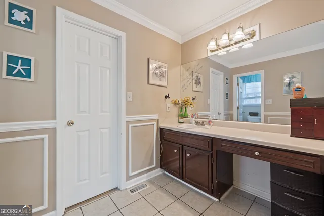 a living room with lots of furniture and a flat screen tv