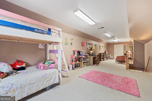 a view of a hallway with furniture and front door