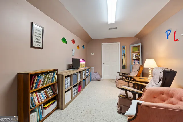 a view of trees and covered with snow in the yard