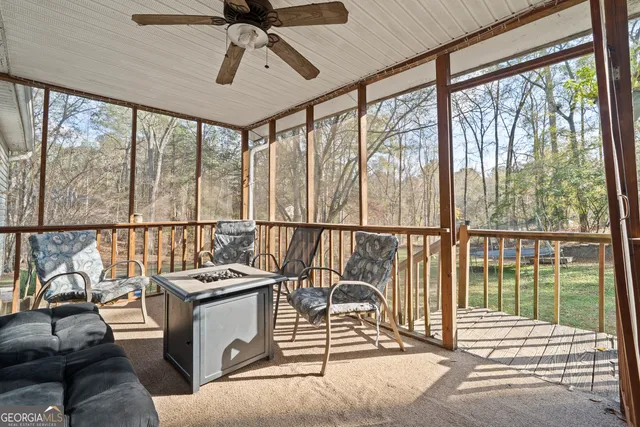 a view of a house with a yard covered in snow