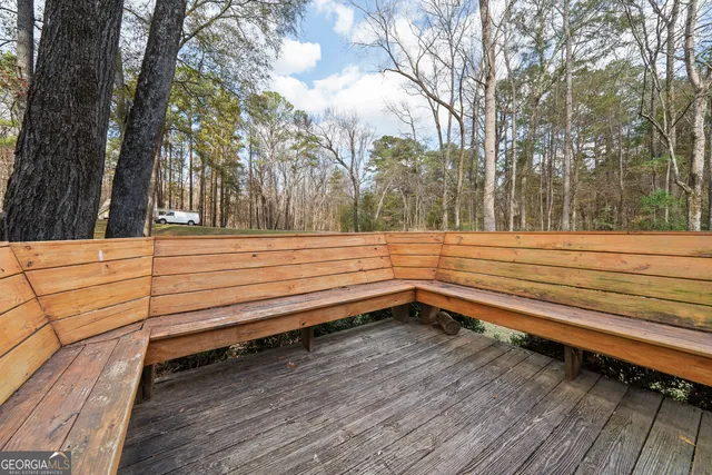a bathroom with a toilet and shower curtain