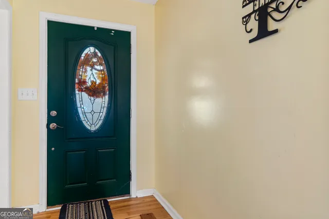 a living room with furniture and a rug